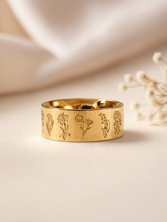 wide gold floral ring engraved botanical band close up texture detail