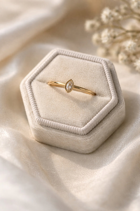 Dainty marquise gold ring 18k PVD stainless steel bezel ring in velvet box close-up