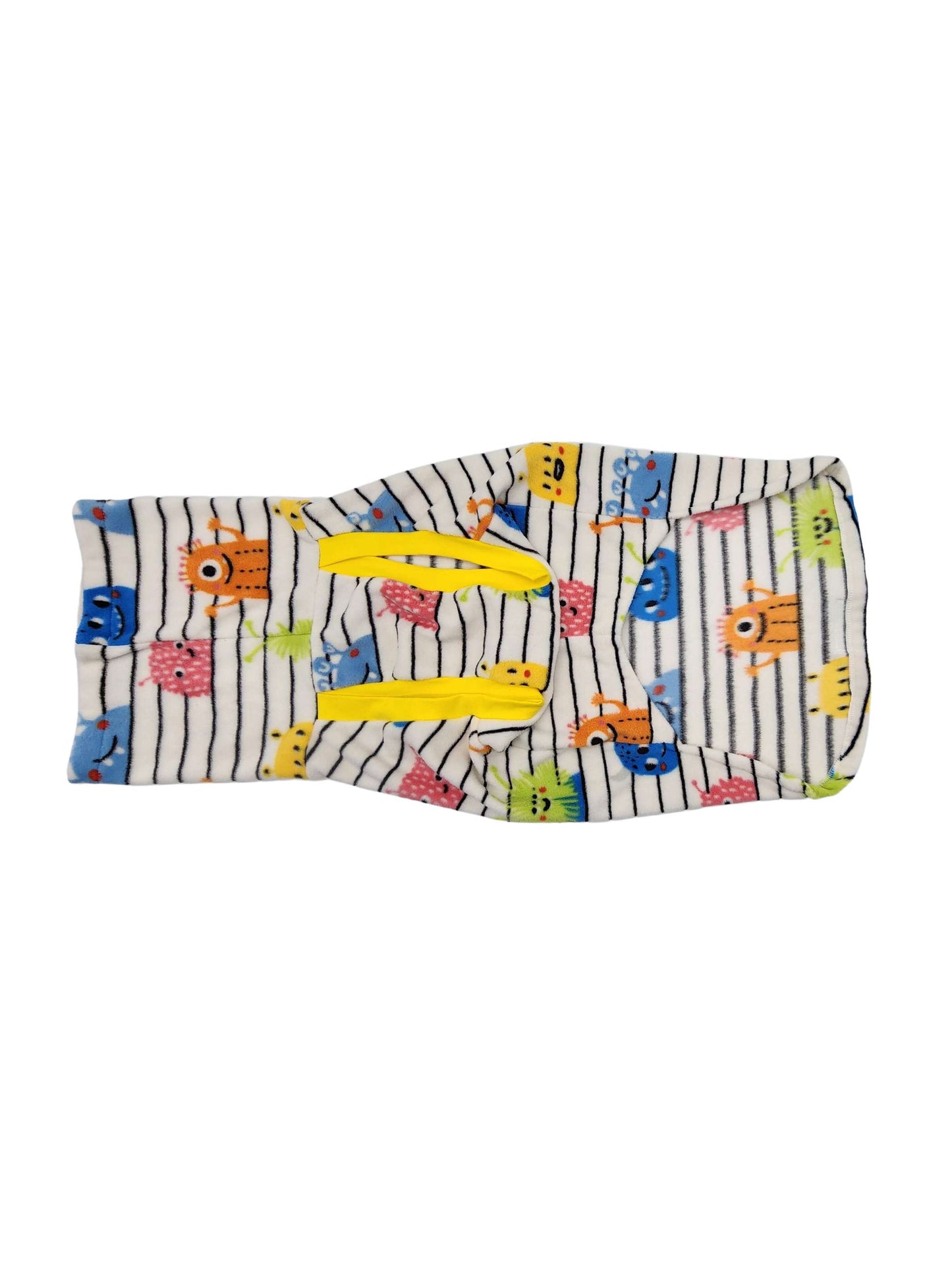 The underside of a fleece dog sweater with a colorful print of monsters