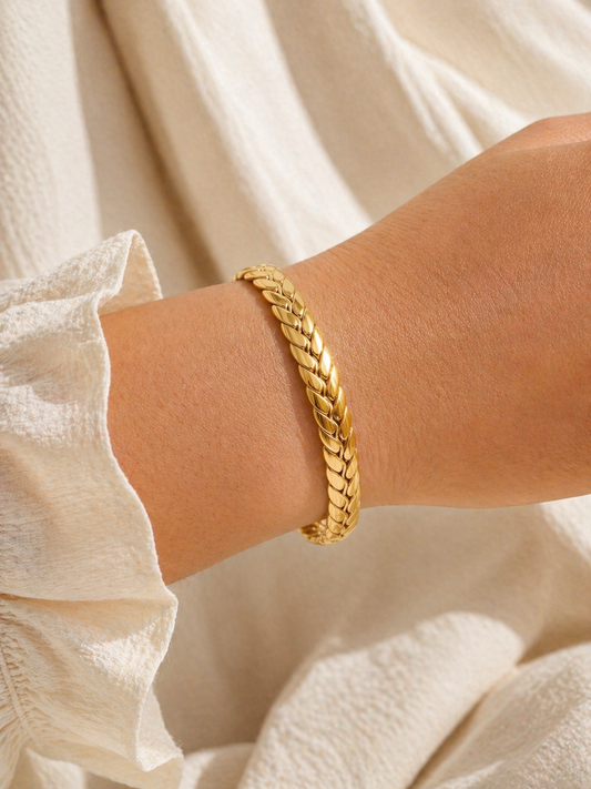 braided gold cuff bracelet worn on wrist woven open bangle everyday styling