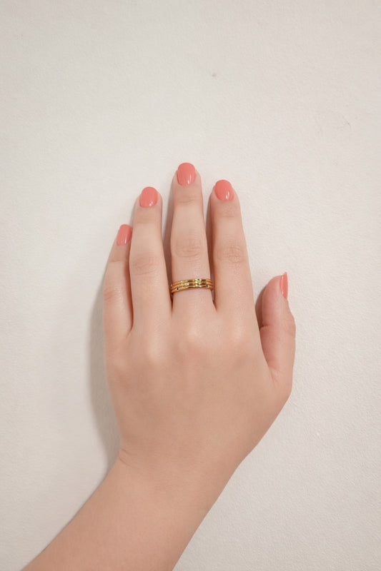 tri color gemstone gold stacking rings 18k pvd stainless steel worn on hand front view neutral background