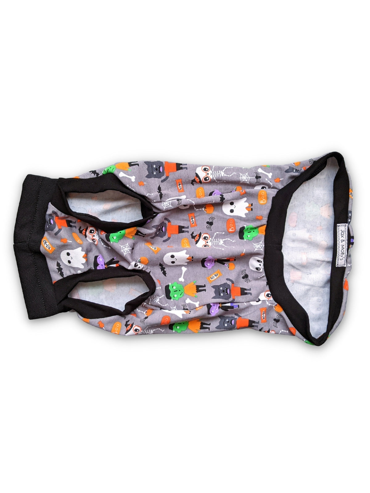 Underbelly View of the monster squad Halloween Dog Muscle Tank by Jax & Molly's, featuring a playful print of iconic monsters like Dracula and Frankensteins accented with black trim on a white background.