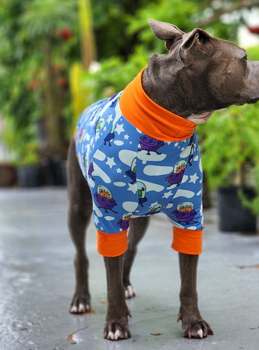 Side view of dog modeling Playful Aliens dog pajamas with fun alien print
