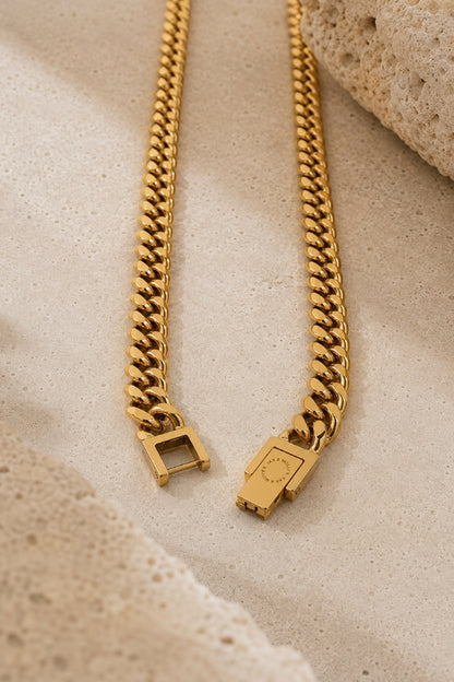Close-up of the open box clasp on the 8mm Cuban Link 18K Gold PVD Necklace showing the secure locking mechanism and engraved JAX & MOLLY'S logo.