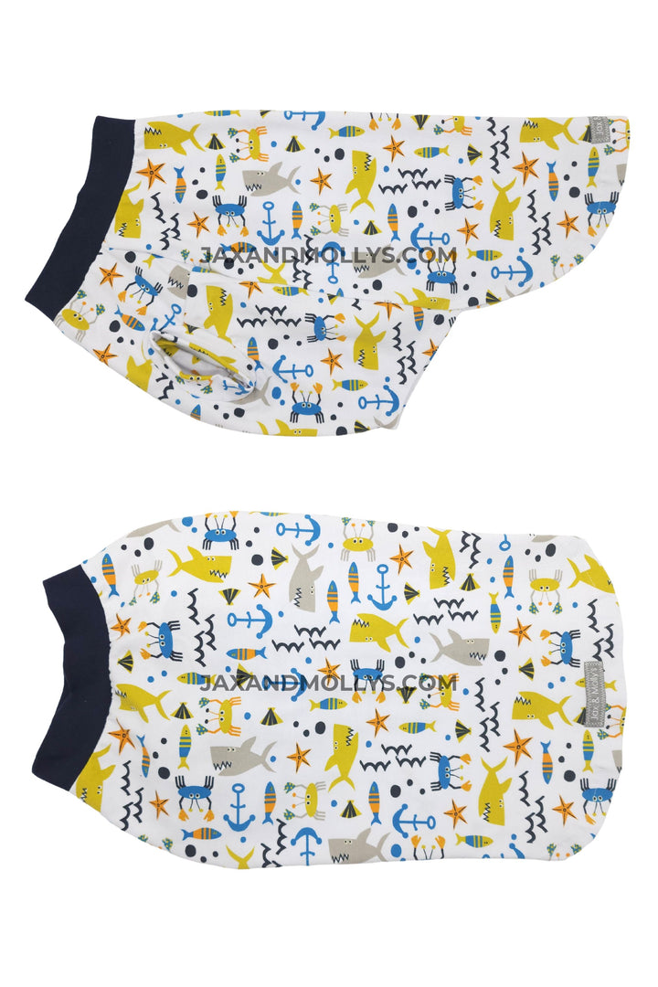 Dog shirt featuring various sea creatures like sharks, fish, and starfish.