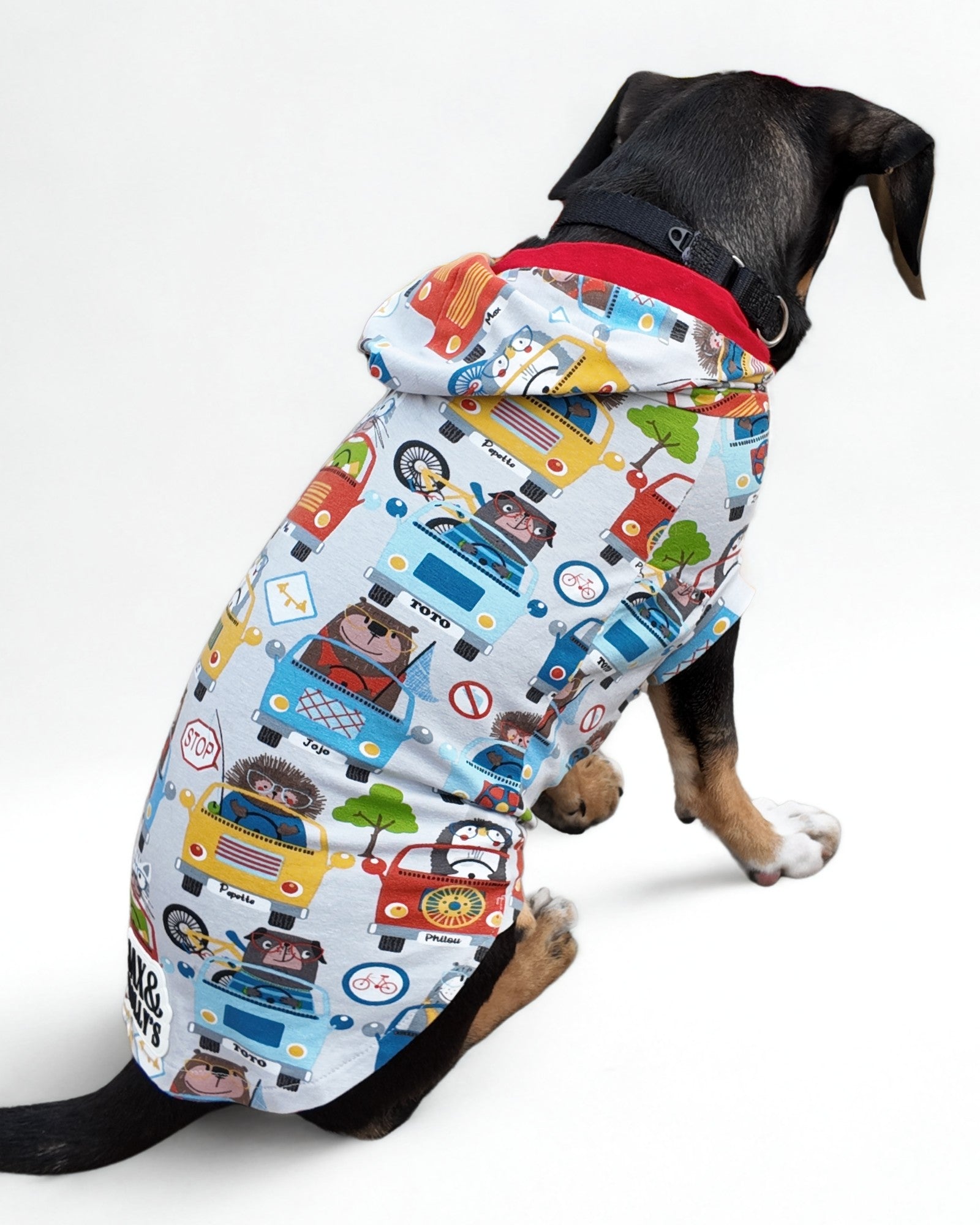 Animal Road Trip cotton dog pajamas with hood, back view on sitting dog