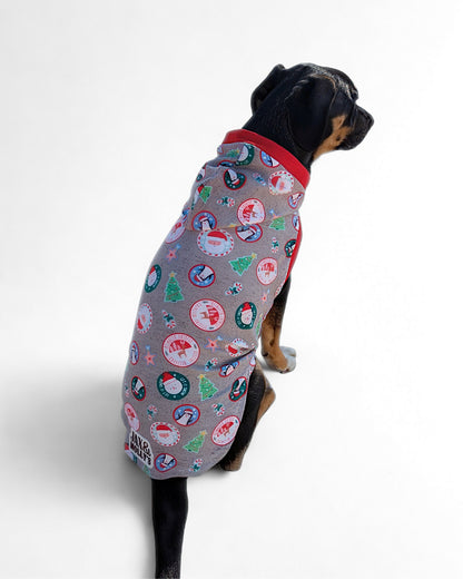 Back view of dog wearing grey Christmas dog pajama with hood and red trim by Jax & Molly’s