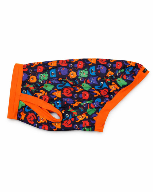 Colorful Monster Comrades dog pajamas with orange trim, side view showing bold monster pattern