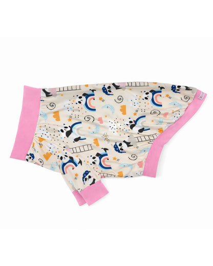 Side view of the 'Dreamy Panda' dog pajamas featuring a sleepy pandas and rainbow print featuring pink trim