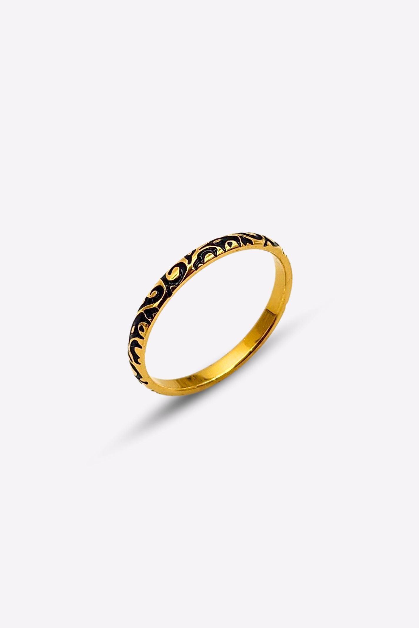Gold ring with black enamel inlay.