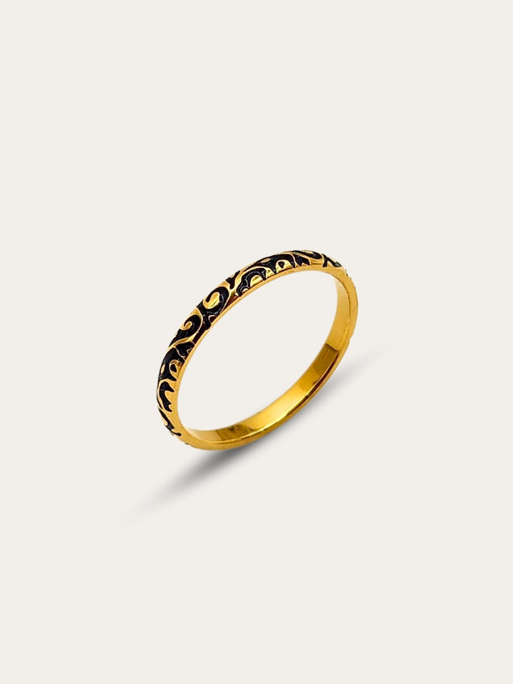 Gold ring with black enamel inlay.