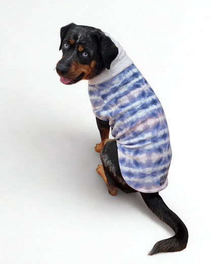 Dog displaying a purple and pink tie-dye fleece pullover sweater from the back