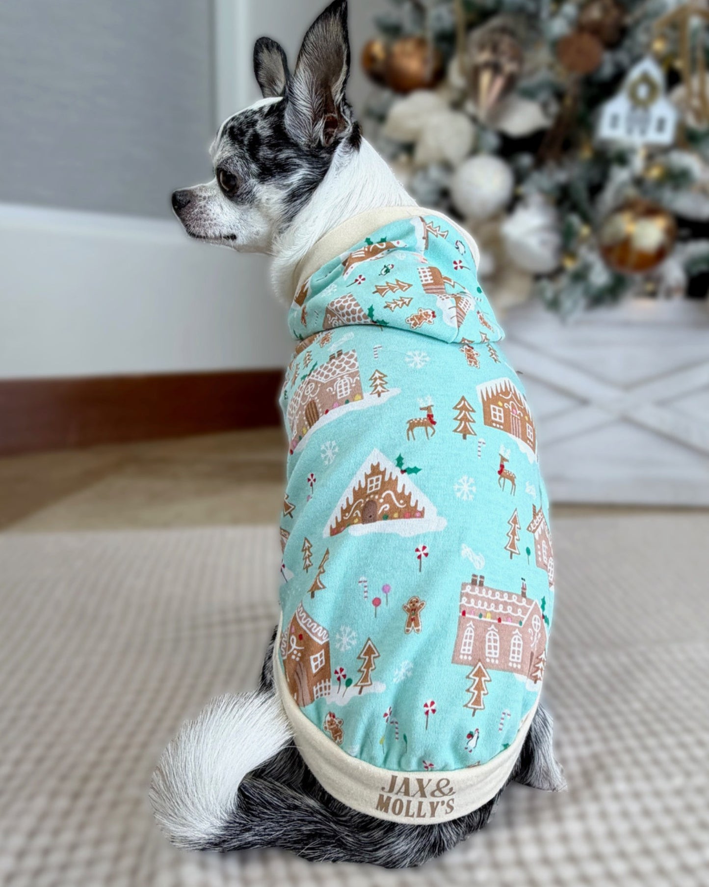 Back view of gingerbread house print dog hoodie with Jax & Molly’s label