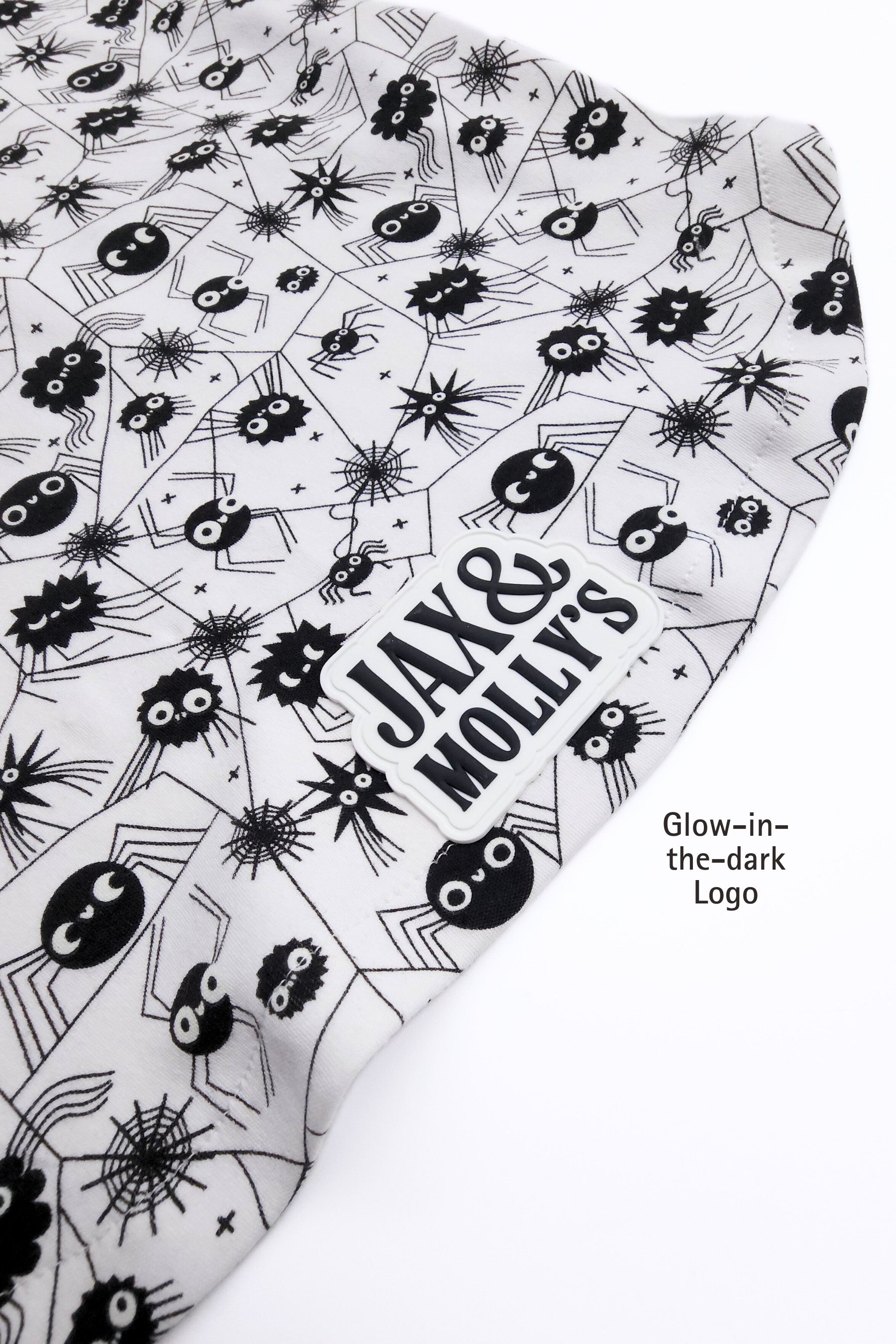 Product with black and white spider pattern and 'Jax & Molly's' text on a white background