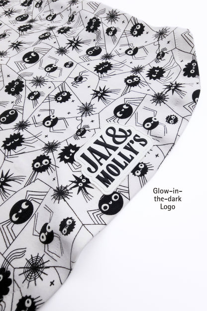 Product with black and white spider pattern and 'Jax & Molly's' text on a white background