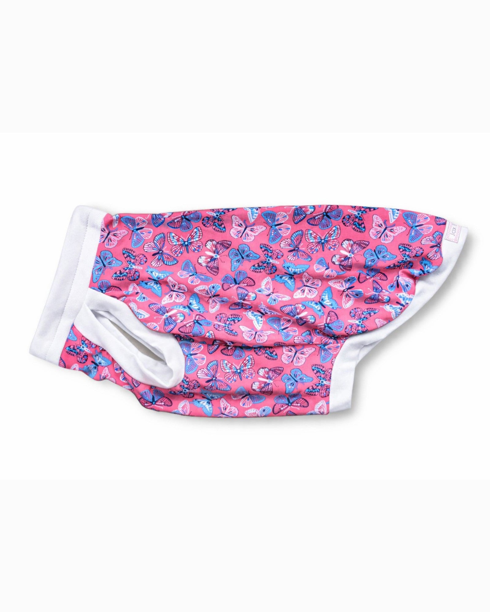 Side view of pink dog pajamas with butterfly print with white trim