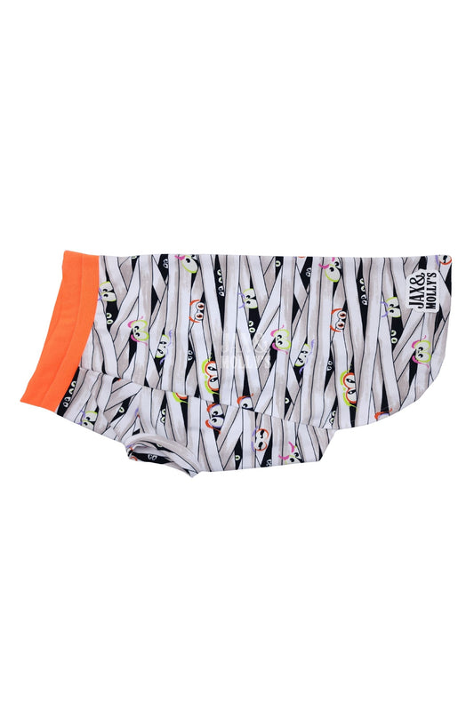 Glow-in-the-dark Halloween dog pajamas with mummy wrap print and orange trim.