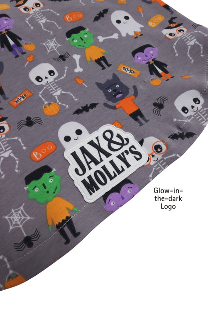 Halloween-themed fabric with cartoon characters and 'Jax & Molly's' logo on a gray background.