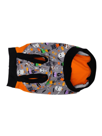 Underbelly view of an orange Halloween-themed dog muscle tank featuring the words Treats Always and an image of a dog dressed in a ghost sheet, monster-print underbelly, and black trim for the neck, sleeves, and waistband.