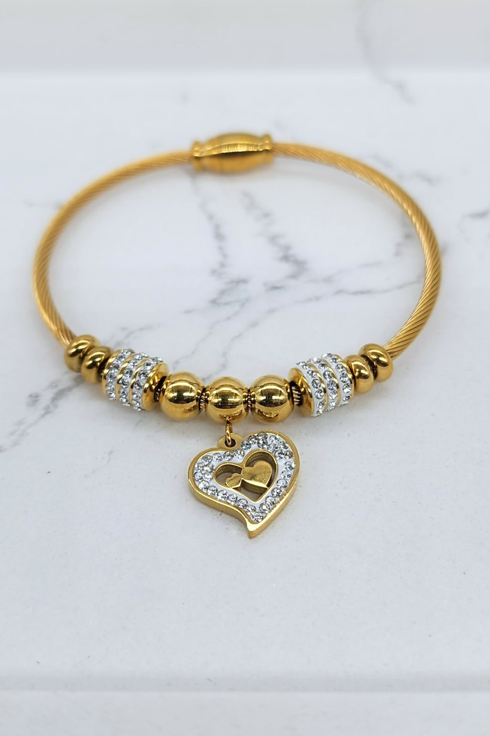 Jax & Molly's 18k gold plated bracelet featuring a cable design with gorgeous heart pendant adorned with crystals.