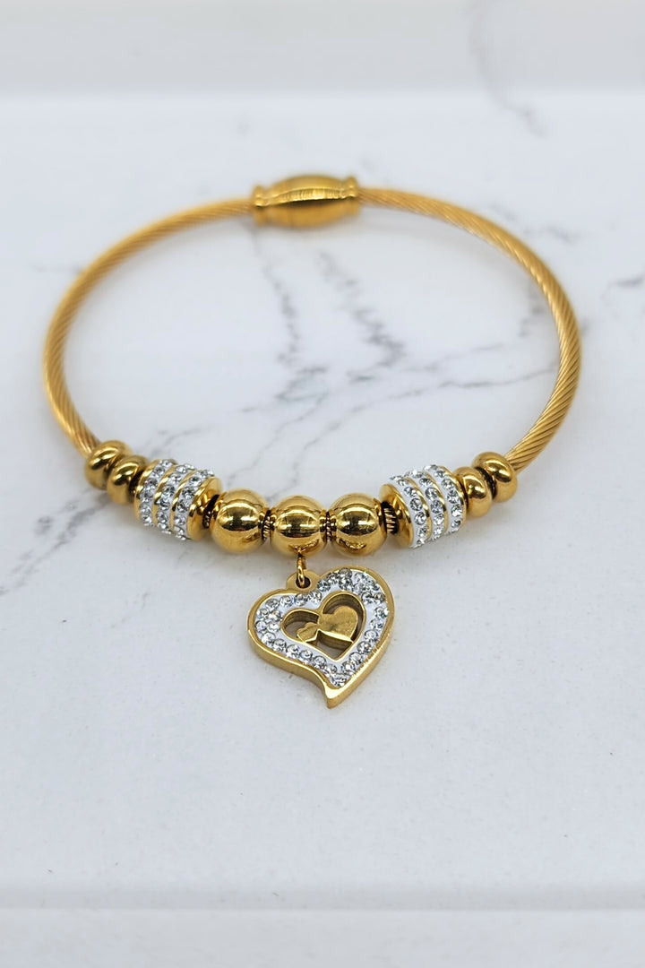 Jax & Molly's 18k gold plated bracelet featuring a cable design with gorgeous heart pendant adorned with crystals.