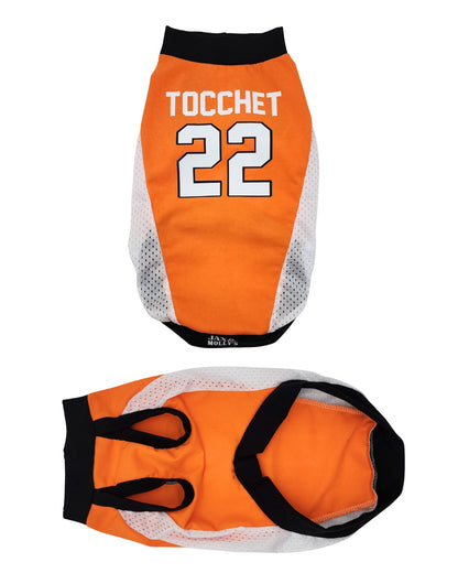 Orange dog sport jersey with black and white details, featuring the name 'Tocchet' and number '22'.