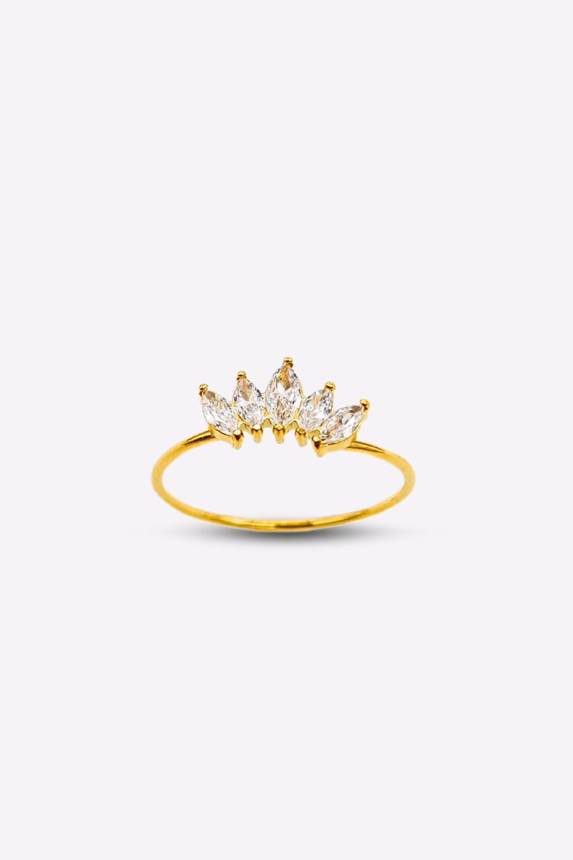 Elegant ring showcasing 5 brilliant clear gemstones set on a crown-inspired, thin gold band, presented against a white backdrop to highlight its beauty.