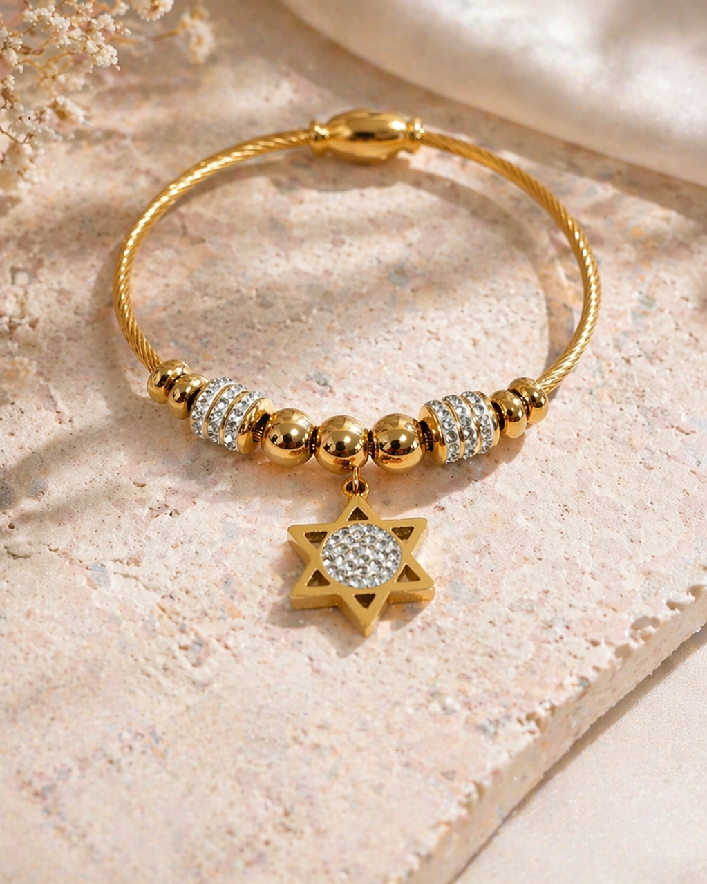 star of david gold bracelet stainless steel flat lay crystal charm close up