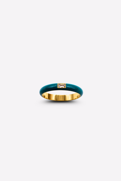 Close-up of the Elegant Teal Enamel Gemstone Ring on a white background, highlighting the vivid teal enamel band and the glimmering rectangular gemstone.