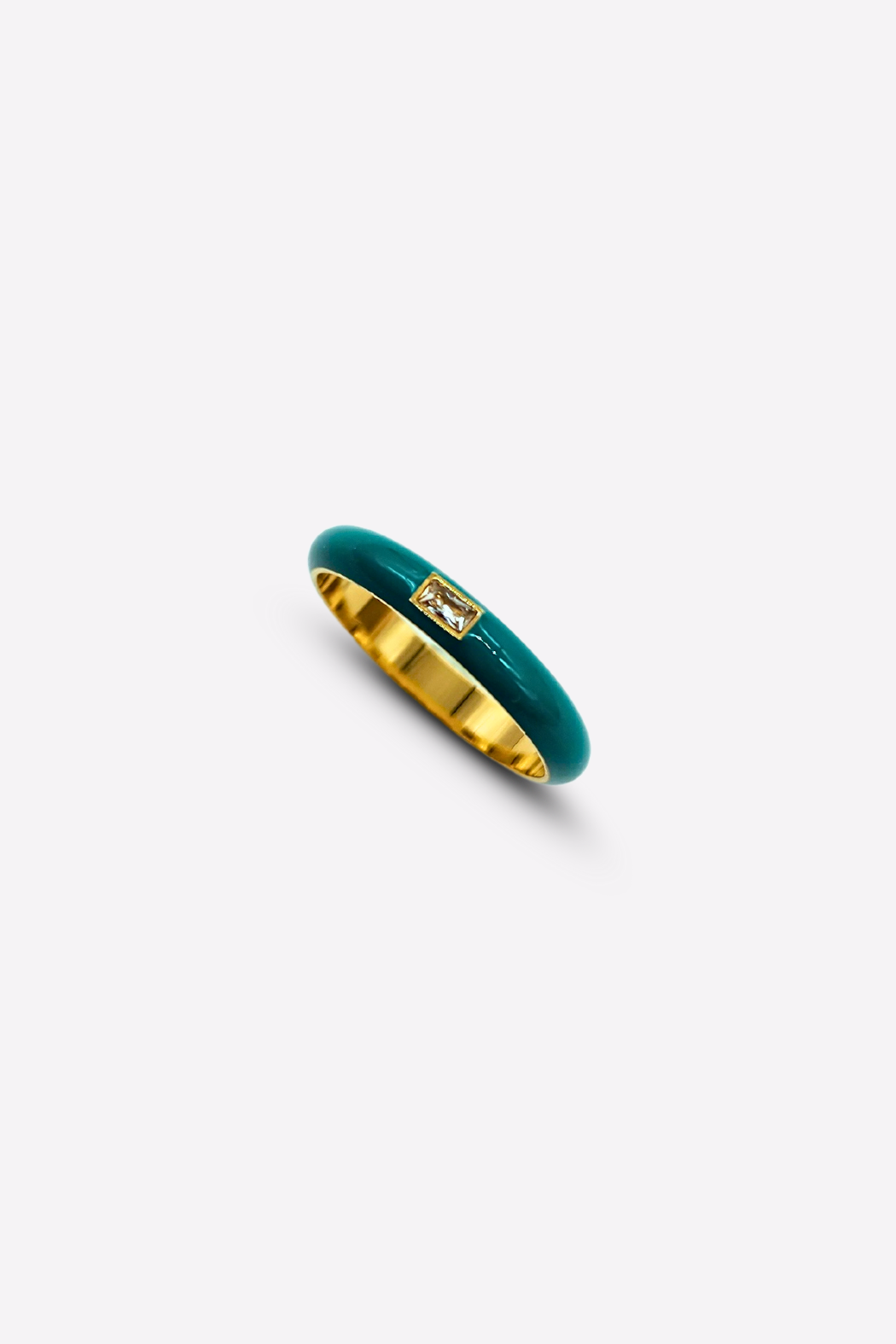 Top view of the Elegant Teal Enamel Gemstone Ring on a white background, emphasizing the sleek modern design and the combination of teal enamel and gold-plated stainless steel.