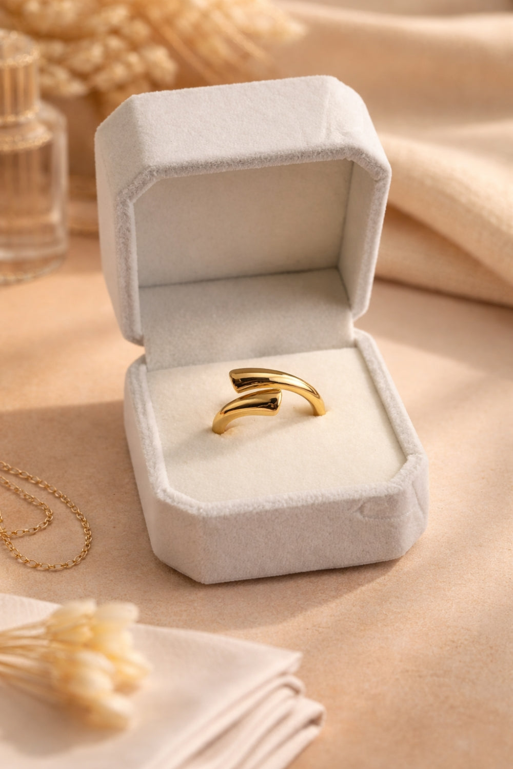 gold adjustable open cuff ring 18k pvd plated stainless steel in velvet jewelry box soft neutral background
