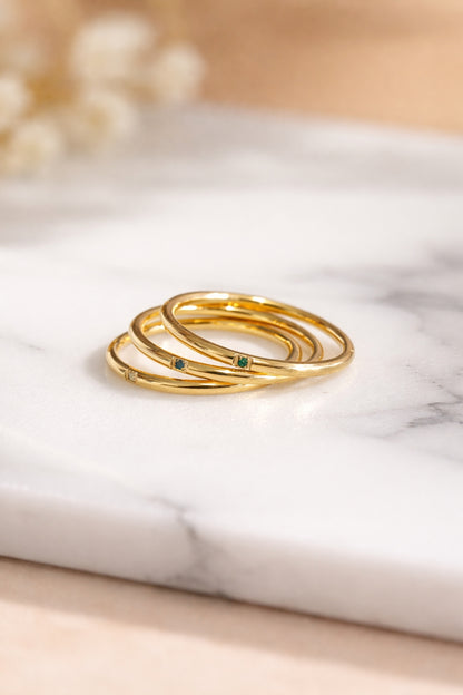 tri color gemstone gold stacking rings 18k pvd stainless steel angled stack close up marble surface