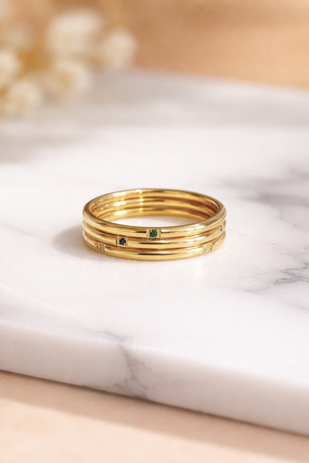 tri color gemstone gold stacking rings 18k pvd stainless steel stacked flat front view marble surface