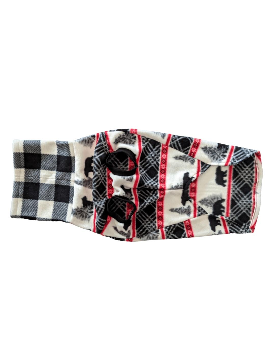 Underbelly view of a fleece dog sweater featuring black bears with pine trees and red accents with a black and white buffalo plaid turtleneck.