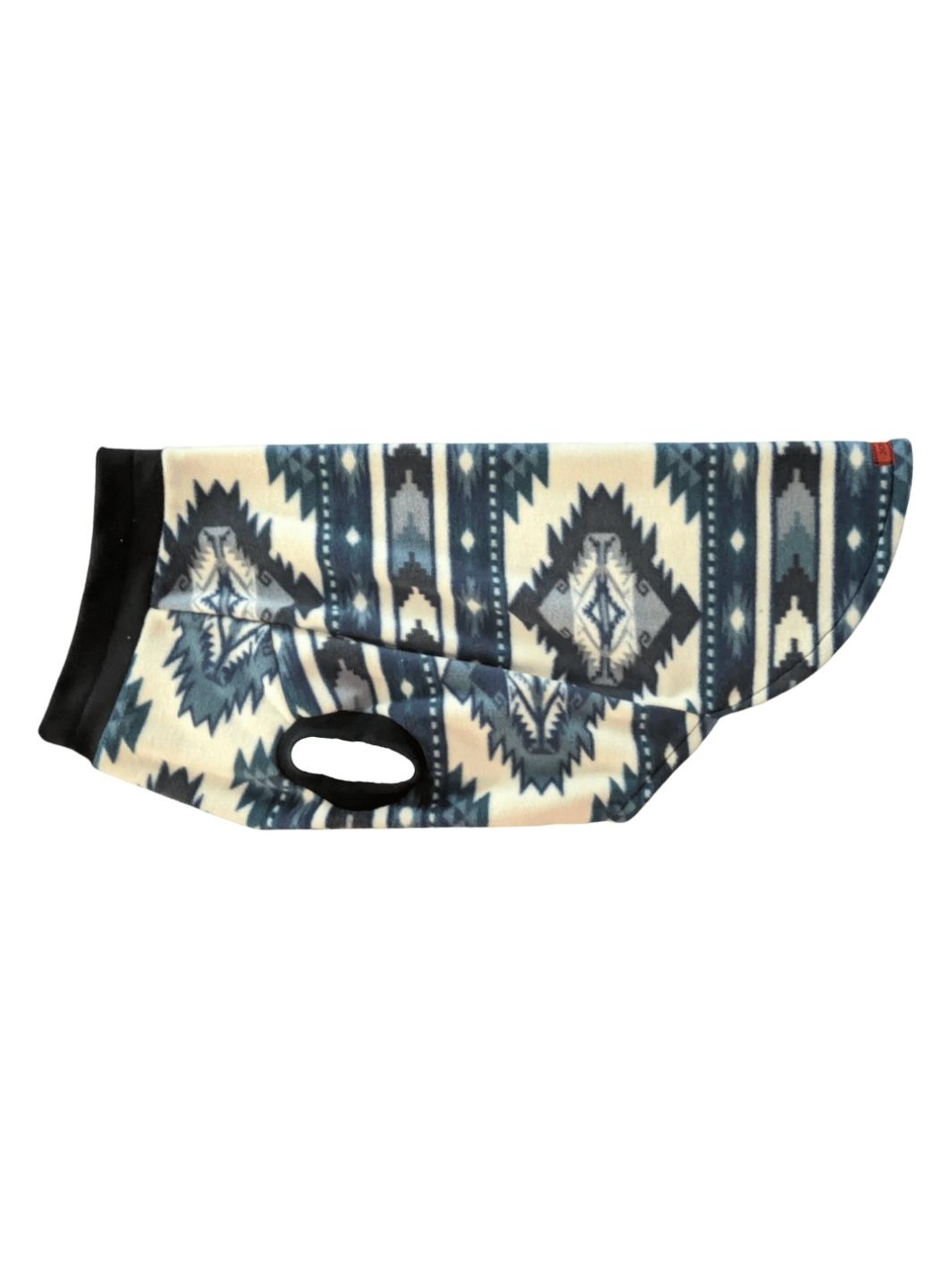 Side display of a blue and off-white aztec print dog sweater complemented by a black neck and sleeve trim.
