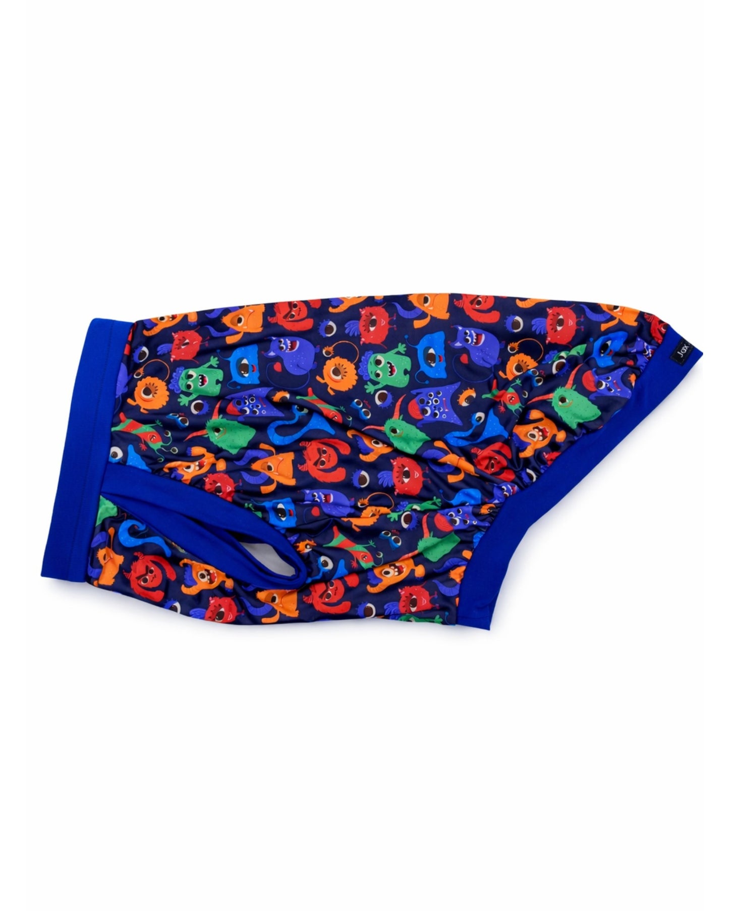 Colorful Monster Comrades dog pajamas with royal blue trim, side view of monster pattern and fit