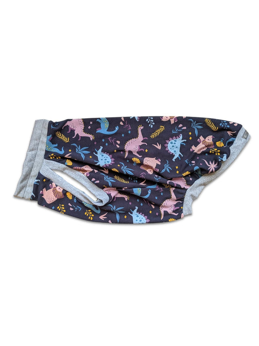 Side profile of Jax & Molly's muscle tank Dog Pajamas, featuring a charming navy background embellished with pastel-colored dinosaurs and grey trim.