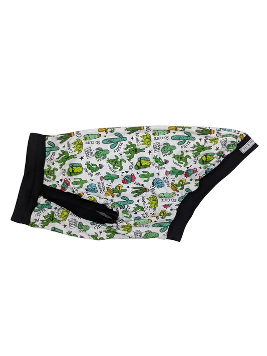 Side display of Jax & Molly's dog pajamas adorned with a silly cacti print and complemented by black trim.