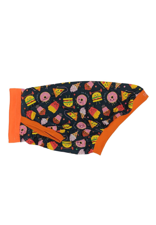 Side display of Jax & Molly's Fitness Junkies Dog pajamas that feature an adorable animated print of junk foods exercising complimented by an orange neck, sleeve and waist trim .