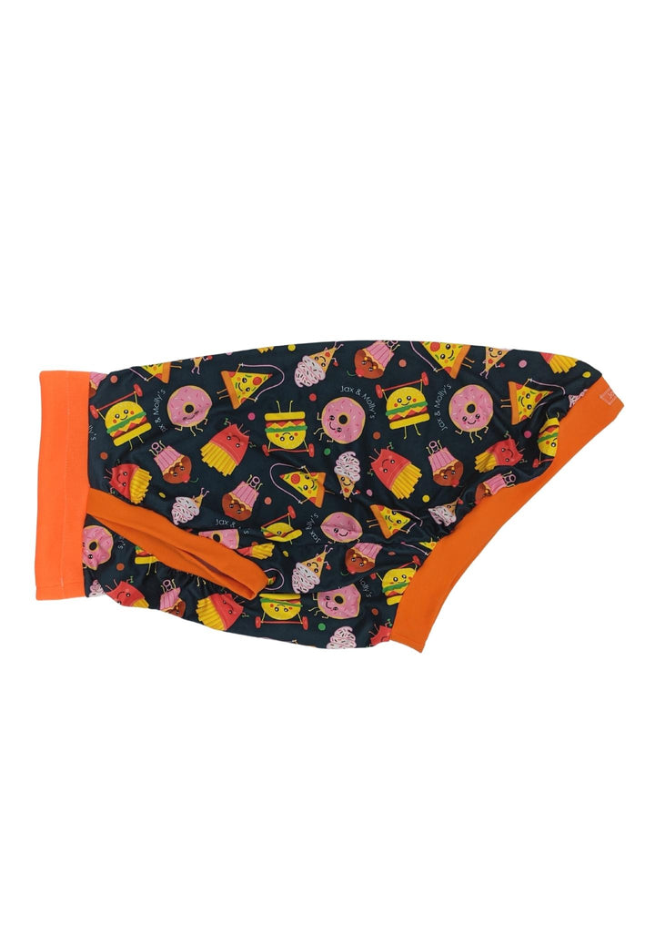 Side display of Jax & Molly's Fitness Junkies Dog pajamas that feature an adorable animated print of junk foods exercising complimented by an orange neck, sleeve and waist trim .
