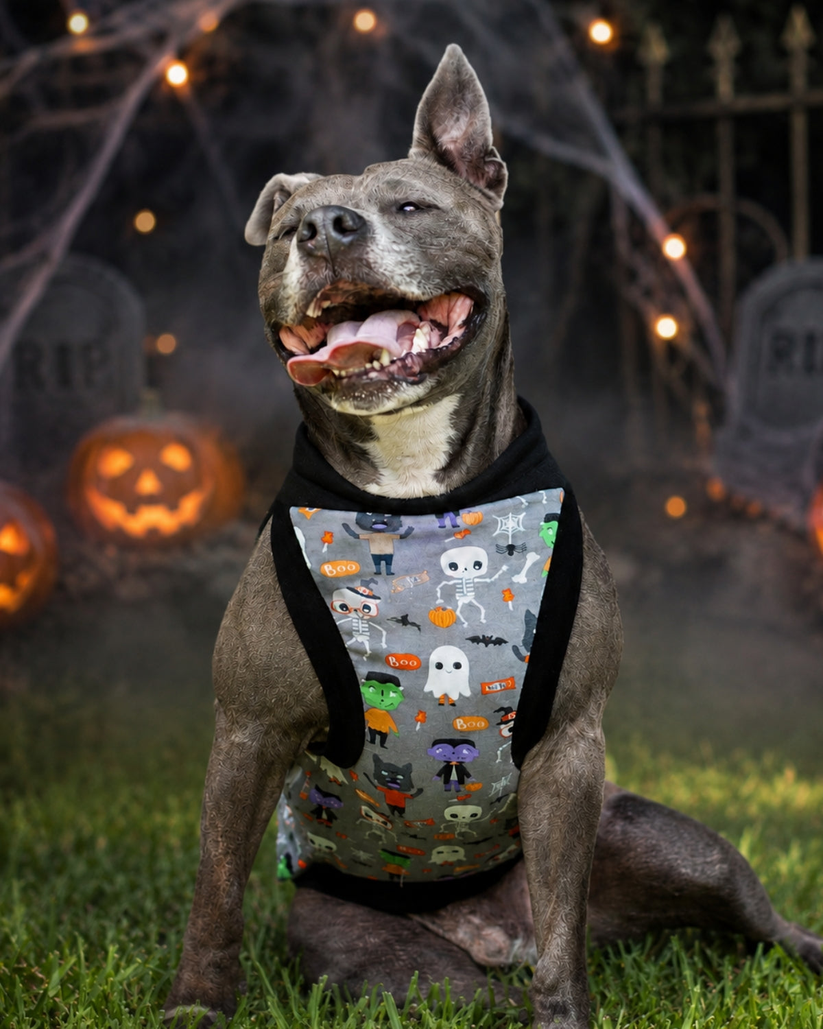 Gray pit bull wearing Monster Squad cotton-spandex Halloween dog pajamas in the Muscle Tank style with black trim.