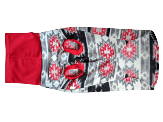 Underbelly view of Jax & Molly's striking Aztec fleece dog sweater in red, gray, white, and black colors and paired with a vibrant red sweatshirt turtleneck.