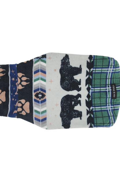 Backside view of a charming dog sweater featuring bear, bear paw prints along with a green plaid backdrop and accents.